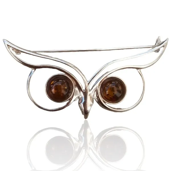 Broszka srebrna maska z bursztynem