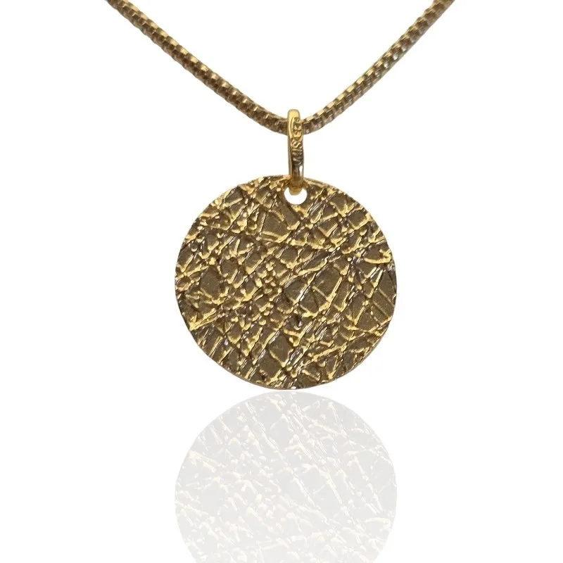 Srebrna zawieszka pozłacana  i karbowana