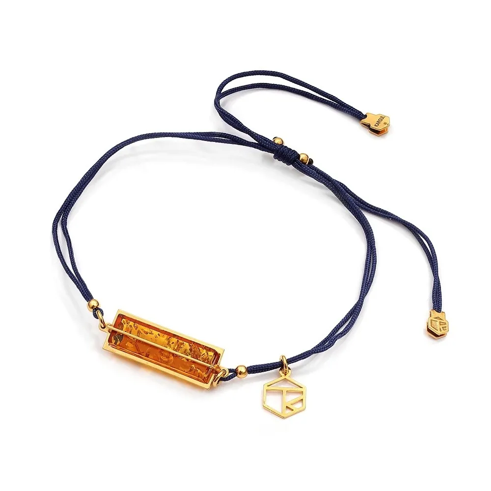 Bransoletka srebrna na  czarnym sznurku z koniakowym bursztynem mikro