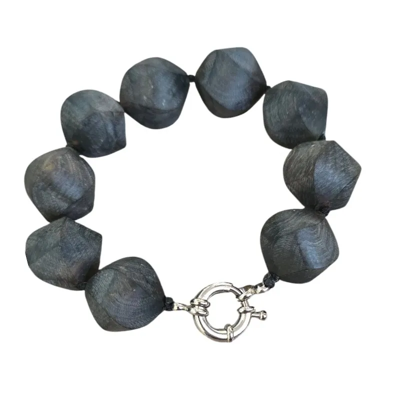 Piękna bransoletka  srebrna z matowych kulek bursztynowych o skrętnym  szlifie