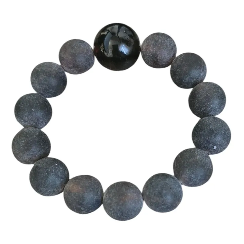 Bransoleta z matowych kul bursztynowych  1,5 cm oraz jednej 1,8 cm polerowanej ciemnej