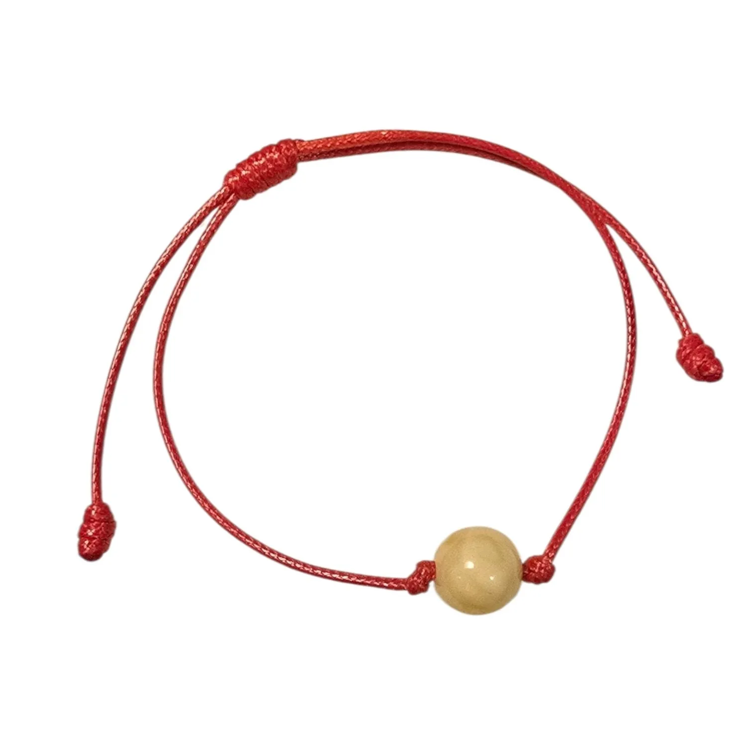 Bransoletka na sznurku bursztynowa kuleczka mleczna