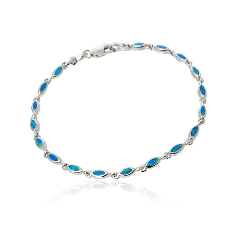 Subtelna bransoletka srebrna z niebieskim opalem