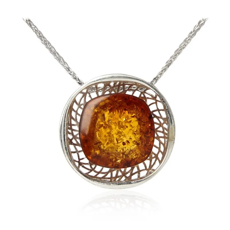 Zawieszka z koniakowym bursztynem  na ażurowej podstawie