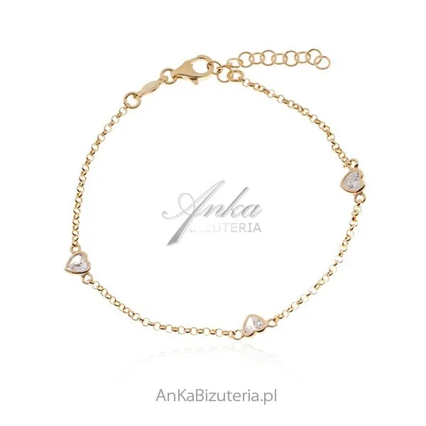 Bransoletka srebrna pozłacana serduszka  z białymi kryształkami swarovski