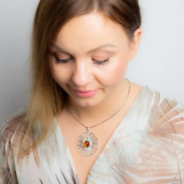 Srebrna zawieszka słońce z bursztynem