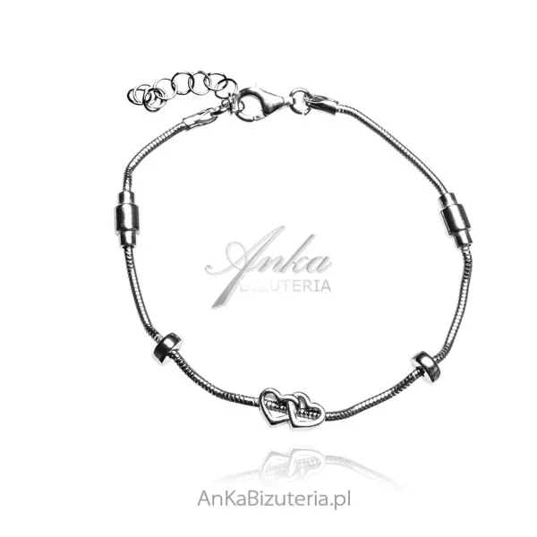 Bransoletka srebrna o wężykowatym splocie dwa serduszka