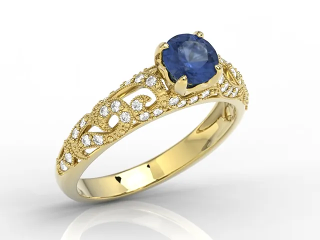 Pierścionek zaręczynowy z żółtego złota z szafirem i diamentami BP-50Z