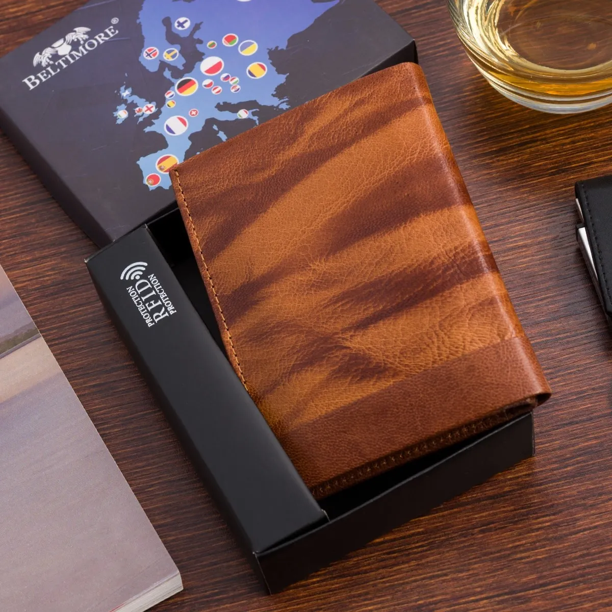 Portfel skórzany męski pionowy Klasyczny brązowy rfid Beltimore D36 Brązowy pionowy portfel dla mężczyzn wykonany ze skóry naturalnej, model D36 od marki Beltimore